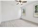 Bright bedroom with neutral tones and two windows offering plenty of natural light at 1914 E Chelsea St, Tampa, FL 33610