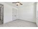 Bedroom with light wood floors, ceiling fan, and a closet at 1914 E Chelsea St, Tampa, FL 33610