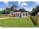 Charming home with a cozy carport, well-maintained lawn, and tidy landscaping at 1914 E Chelsea St, Tampa, FL 33610