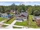 Charming single-story home features a modern exterior, well-manicured lawn, and a paved walkway leading to the front door at 1914 E Chelsea St, Tampa, FL 33610
