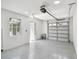 Two-car garage with epoxy floor and exterior access door at 1914 E Chelsea St, Tampa, FL 33610
