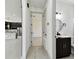 Hallway that leads to a bathroom and kitchen at 1914 E Chelsea St, Tampa, FL 33610