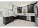 Open concept kitchen with stainless appliances, island and ample counter space, perfect for entertaining at 1914 E Chelsea St, Tampa, FL 33610