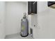 Utility room featuring water heater at 1914 E Chelsea St, Tampa, FL 33610