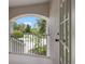 Balcony with metal railing showcasing beautiful green foliage and a blue sky at 21108 Bircholm Ct, Land O Lakes, FL 34637
