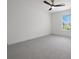 A standard empty bedroom space with carpet and a ceiling fan at 21108 Bircholm Ct, Land O Lakes, FL 34637