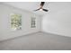 A standard empty bedroom space with carpet at 21108 Bircholm Ct, Land O Lakes, FL 34637