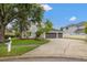 Charming two-story home with a three car garage and well-manicured lawn at 21108 Bircholm Ct, Land O Lakes, FL 34637