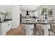 Bright kitchen features a large island with seating and sleek white cabinets, complemented by modern countertops at 21108 Bircholm Ct, Land O Lakes, FL 34637