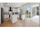 Well-lit kitchen featuring white cabinets, stainless steel appliances, and a view of the backyard, offering style and functionality at 21108 Bircholm Ct, Land O Lakes, FL 34637