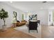 Bright living room with neutral paint, hardwood floors, and modern furnishings at 21108 Bircholm Ct, Land O Lakes, FL 34637
