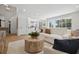 Bright living area featuring hardwood floors, comfortable seating, and view of the backyard at 21108 Bircholm Ct, Land O Lakes, FL 34637