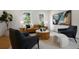 Living room features bright lighting, modern decor, and hardwood floors at 21108 Bircholm Ct, Land O Lakes, FL 34637