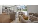 Living area showcasing comfortable seating and backyard pool view at 21108 Bircholm Ct, Land O Lakes, FL 34637