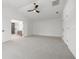 Spacious main bedroom with neutral carpet and ensuite bathroom with dual doors at 21108 Bircholm Ct, Land O Lakes, FL 34637