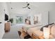 Beautiful main bedroom with balcony, ceiling fan, hardwood floors and ensuite bathroom at 21108 Bircholm Ct, Land O Lakes, FL 34637