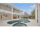 Outdoor pool and spa with a screened enclosure, offering privacy and a scenic view of the property at 21108 Bircholm Ct, Land O Lakes, FL 34637