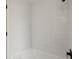 White tiled shower and tub at 21108 Bircholm Ct, Land O Lakes, FL 34637