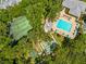 Aerial view showcasing community amenities including a pool, tennis, and basketball courts at 2175 Fox Chase Blvd, Palm Harbor, FL 34683