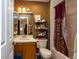 Bathroom with a vanity, mirror, tiled bathtub, and shower, offering a functional and well-equipped space at 2175 Fox Chase Blvd, Palm Harbor, FL 34683