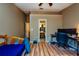 Spacious bedroom with laminate flooring, a ceiling fan, and access to the bathroom and closet area at 2175 Fox Chase Blvd, Palm Harbor, FL 34683