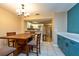 Open dining area with seamless view into a modern kitchen at 2175 Fox Chase Blvd, Palm Harbor, FL 34683