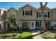 Charming townhome featuring a well-maintained front yard and a welcoming entrance at 2175 Fox Chase Blvd, Palm Harbor, FL 34683