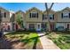 Charming townhomes with well-manicured lawns and beautiful landscaping at 2175 Fox Chase Blvd, Palm Harbor, FL 34683