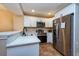Bright, renovated kitchen featuring white cabinets and stainless steel appliances at 2175 Fox Chase Blvd, Palm Harbor, FL 34683