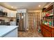 Spacious kitchen with white cabinetry and modern stainless steel appliances at 2175 Fox Chase Blvd, Palm Harbor, FL 34683