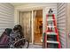 Covered patio has sliding glass door leading to interior and an outdoor light fixture at 2175 Fox Chase Blvd, Palm Harbor, FL 34683