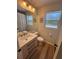 Bathroom with newer vanity and updated lighting at 222 Spring Lake Hwy, Brooksville, FL 34602