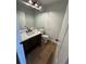 Powder room features vanity with granite countertop, and modern fixtures at 222 Spring Lake Hwy, Brooksville, FL 34602