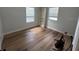 Cozy bedroom with natural light and hardwood floors at 222 Spring Lake Hwy, Brooksville, FL 34602