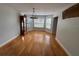 Spacious dining room with wood floors, ample light, and traditional style at 222 Spring Lake Hwy, Brooksville, FL 34602