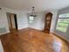 Dining room with neutral paint, hardwood floors, and updated lighting at 222 Spring Lake Hwy, Brooksville, FL 34602