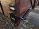Close up of an automatic Ghost Controls gate opening mechanism attached to the fence at 222 Spring Lake Hwy, Brooksville, FL 34602