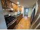 Modern kitchen with stainless steel appliances, granite countertops, and ample cabinet space at 222 Spring Lake Hwy, Brooksville, FL 34602