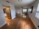 Living room featuring hardwood floors, natural light, and neutral paint offering a cozy atmosphere at 222 Spring Lake Hwy, Brooksville, FL 34602