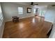 Living room featuring hardwood floors, natural light, and neutral paint offering a cozy atmosphere at 222 Spring Lake Hwy, Brooksville, FL 34602