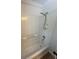 Bathroom with updated shower and tile surround at 222 Spring Lake Hwy, Brooksville, FL 34602