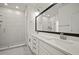 Sleek bathroom with double sink vanity, frameless glass shower, and modern fixtures at 2511 N Grady Ave # 43, Tampa, FL 33607