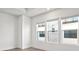 Bright bedroom with three windows offering natural light, laminate floors, and modern trim at 2511 N Grady Ave # 43, Tampa, FL 33607