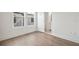 Clean bedroom with light-colored flooring and natural lighting, leading into the bathroom at 2511 N Grady Ave # 43, Tampa, FL 33607
