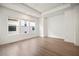 Bright bedroom featuring recessed lighting, three windows providing natural light, and sleek laminate floors at 2511 N Grady Ave # 43, Tampa, FL 33607