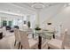 Elegant dining room featuring a glass top table and bright sunlight at 2511 N Grady Ave # 43, Tampa, FL 33607