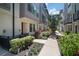 Modern townhouse exterior featuring well-maintained landscaping and neutral color palette at 2511 N Grady Ave # 43, Tampa, FL 33607