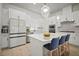 Modern eat-in kitchen with white cabinets and stainless appliances at 2511 N Grady Ave # 43, Tampa, FL 33607