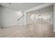 Bright and airy living room with light wood flooring, white walls, and open floor plan at 2511 N Grady Ave # 43, Tampa, FL 33607