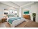 Well-lit main bedroom with tray ceiling, laminate flooring, and contemporary decor at 2511 N Grady Ave # 43, Tampa, FL 33607